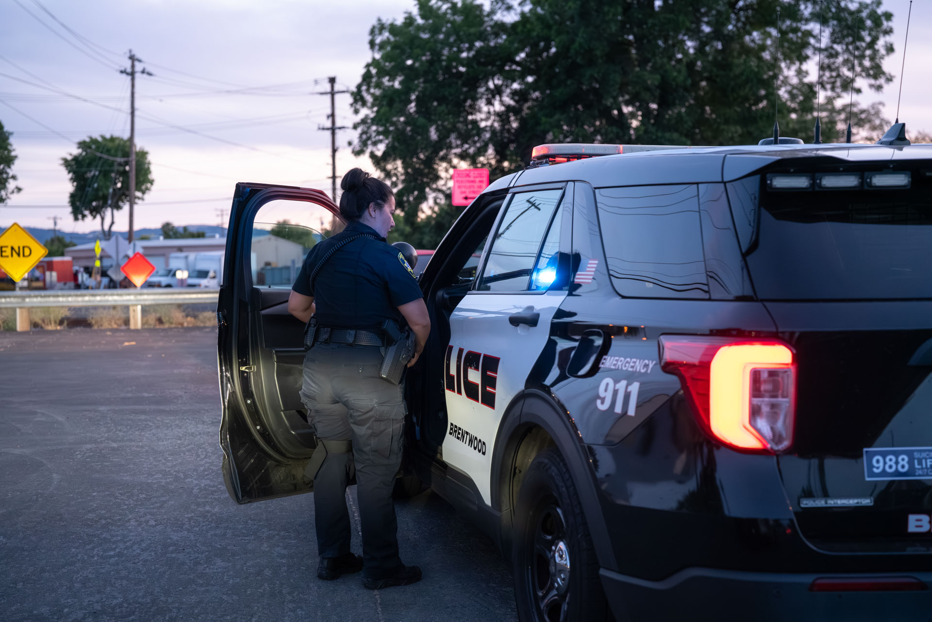 Officer at the door of a Brentwood patrol SUV